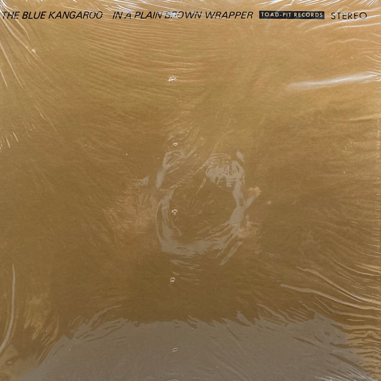 The Blue Kangaroo – In A Plain Brown Wrapper